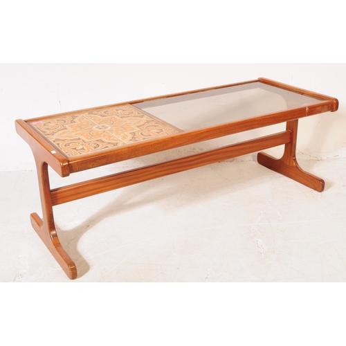 643 - G-Plan - A mid 20th century G-Plan teak wood tile and glass topped coffee table. The coffee table ra... 