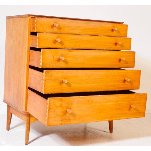 645 - Alfred Cox - A mid 20th century walnut chest of drawers. The chest of drawers raised on tapered legs... 