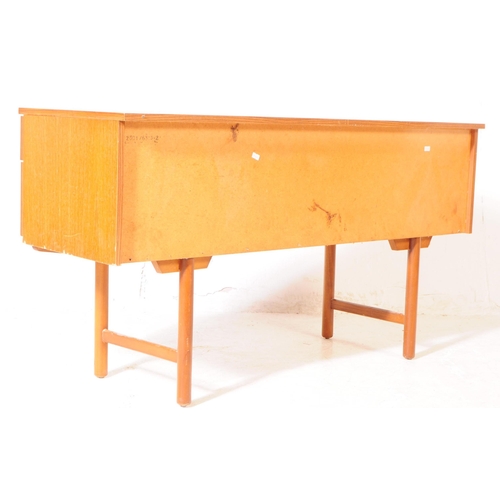 646 - Avalon Furniture - A mid 20th century teak veneer small proportioned sideboard. The sideboard raised... 