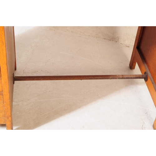 648 - A mid 20th century 1940s Air Ministry manner oak wood desk. The desk raised on block feet, having a ... 