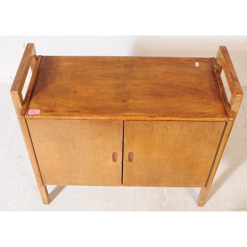 650 - British Modern Design - A mid 20th century circa 1940s oak wood record / music cabinet. The cabinet ... 