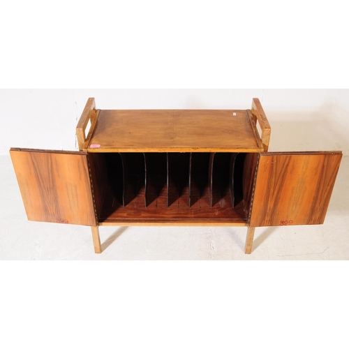 650 - British Modern Design - A mid 20th century circa 1940s oak wood record / music cabinet. The cabinet ... 