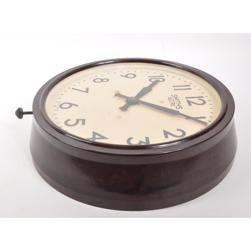 651 - Smiths - A 1940s Smiths Sectric brown bakelite wall clock, alongside another. The clock of circular ... 