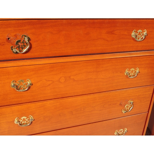 656 - Stag Furniture - A mid 20th Century stag chest of drawers having five bank of drawers, raised on pli... 