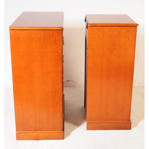 656 - Stag Furniture - A mid 20th Century stag chest of drawers having five bank of drawers, raised on pli... 