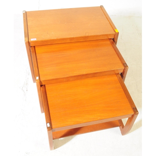 658 - British Modern Design - A mid 20th century teak wood nest of tables. The nest featuring three tables... 