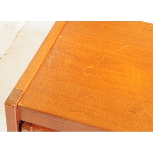 658 - British Modern Design - A mid 20th century teak wood nest of tables. The nest featuring three tables... 