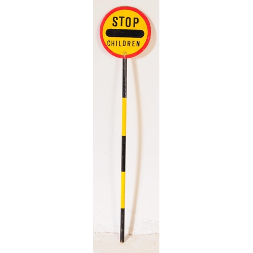 664 - A vintage 20th century lollipop lady's hand held wooden sign. The sign circular with red border & ye... 