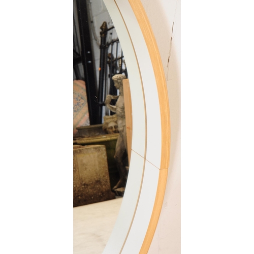 685 - A large contemporary circular wall hanging mirror. Having a chipboard back, plywood / bentwood frame... 