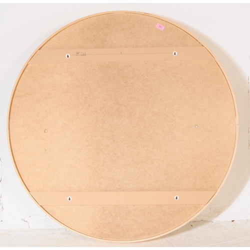 685 - A large contemporary circular wall hanging mirror. Having a chipboard back, plywood / bentwood frame... 