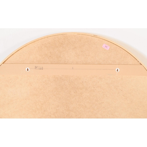 685 - A large contemporary circular wall hanging mirror. Having a chipboard back, plywood / bentwood frame... 