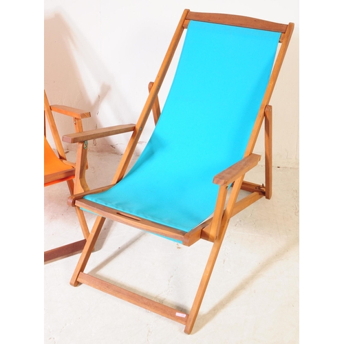 686 - Charles Bentley - A pair of contemporary hardwood garden deck chairs. Solid wood teak frames and arm... 