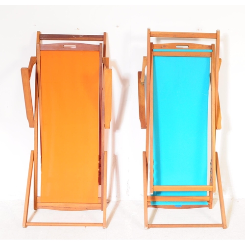 686 - Charles Bentley - A pair of contemporary hardwood garden deck chairs. Solid wood teak frames and arm... 