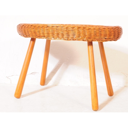 687 - British Modern Design - A vintage mid century oval occasional / coffee table. With rattan rim and ta... 