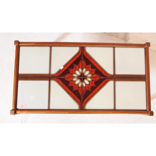 691 - British Modern Design - Mid century teak tile top coffee / occasional table. Rectangular form with t... 