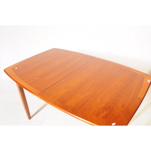 692 - Meredew Furniture - A retro mid 20th century teak extending dining table with six dining chairs (bel... 