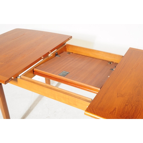 692 - Meredew Furniture - A retro mid 20th century teak extending dining table with six dining chairs (bel... 