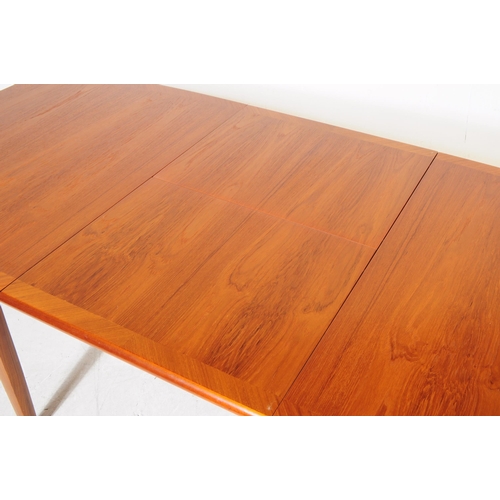 692 - Meredew Furniture - A retro mid 20th century teak extending dining table with six dining chairs (bel... 