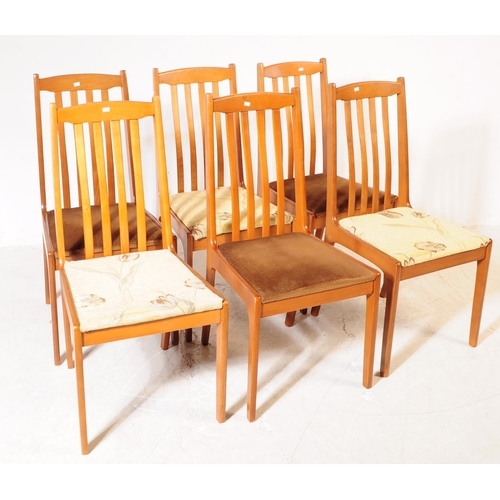 692 - Meredew Furniture - A retro mid 20th century teak extending dining table with six dining chairs (bel... 