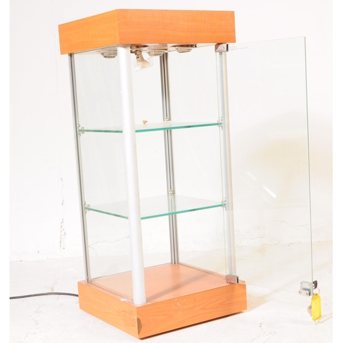 698 - A late 20th century shop front point of sale display cabinet. The cabinet raised on a plinth base, w... 