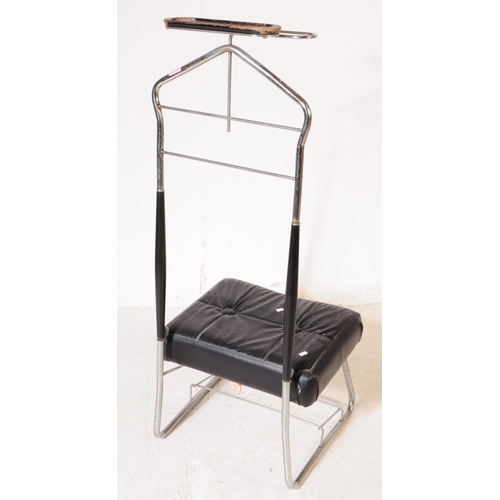 704 - A mid 20th century gentleman's chrome vanity stand. The stand having a bent metal frame, with padded... 