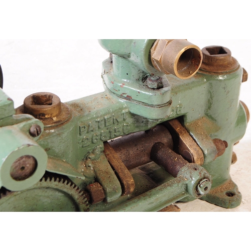 710 - Lister - A mid 20th century small proportioned Lister stationary engine / pump. The painted in in a ... 