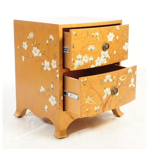 713 - A pair of vintage circa 1940s bedside cabinets painted in a gold colourway with chinoiseries type lo... 