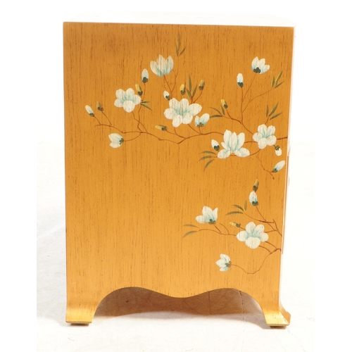 713 - A pair of vintage circa 1940s bedside cabinets painted in a gold colourway with chinoiseries type lo... 