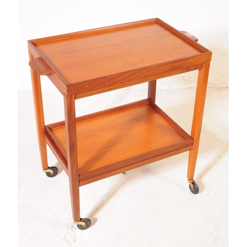 714 - British Modern Design - A mid 20th century circa 1960s teak drinks hostess cocktail trolley. The tro... 