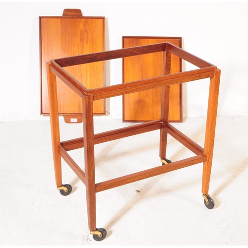 714 - British Modern Design - A mid 20th century circa 1960s teak drinks hostess cocktail trolley. The tro... 