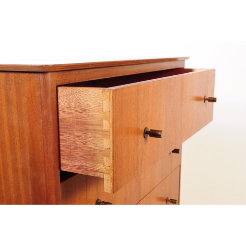 715 - British Modern Design - A mid 20th century circa 1960s teak chest of drawers having a series of seve... 