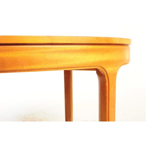 721 - Nathan Furniture - A mid 20th century circa 1970s Nathan teak extending dining table. The table havi... 