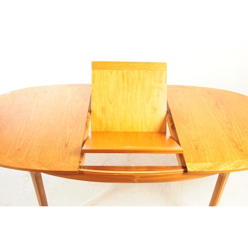 721 - Nathan Furniture - A mid 20th century circa 1970s Nathan teak extending dining table. The table havi... 