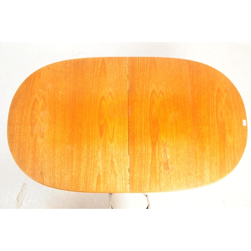 722 - Meredew Furniture - A mid 20th century circa 1970s Meredew teak extending dining table. The table ha... 