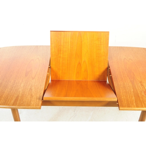 722 - Meredew Furniture - A mid 20th century circa 1970s Meredew teak extending dining table. The table ha... 