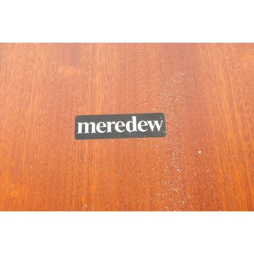 722 - Meredew Furniture - A mid 20th century circa 1970s Meredew teak extending dining table. The table ha... 