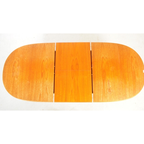 722 - Meredew Furniture - A mid 20th century circa 1970s Meredew teak extending dining table. The table ha... 