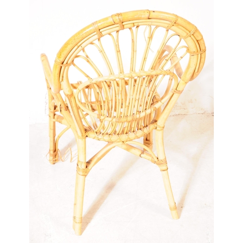 724 - A 20th Century circa 1970s vintage bamboo chair having rounded backrest with fan like design. Measur... 