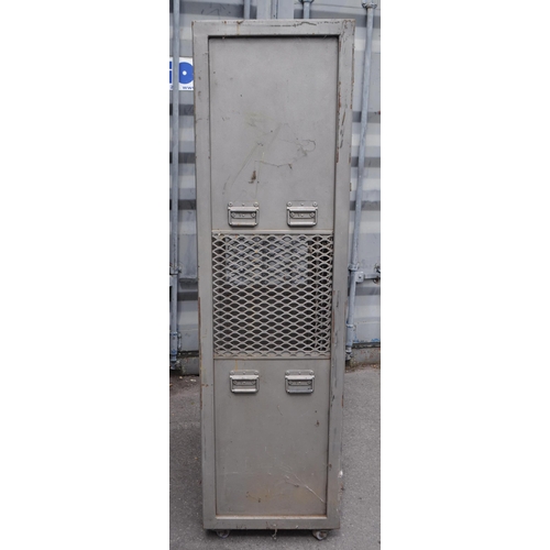 752 - A 20th Century retro industrial metal storage two door locker cage raised on castor wheels. Of recta... 