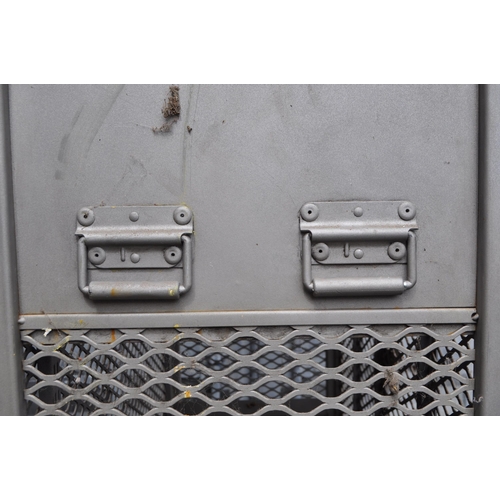 752 - A 20th Century retro industrial metal storage two door locker cage raised on castor wheels. Of recta... 