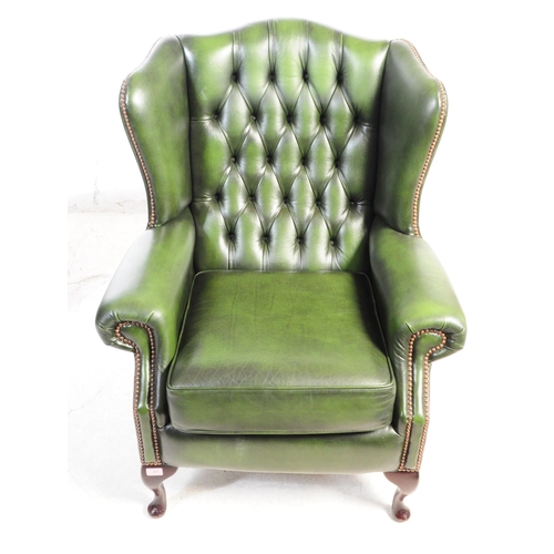 801 - Contemporary pair of green chesterfield wing back lounge Queen Anne armchairs. Having the green butt... 