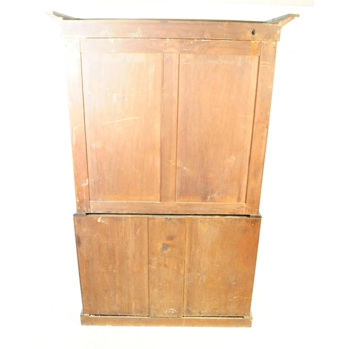 803 - A 19th century Victorian flame mahogany linen press cupboard. Having a cornice to top, with twin woo... 