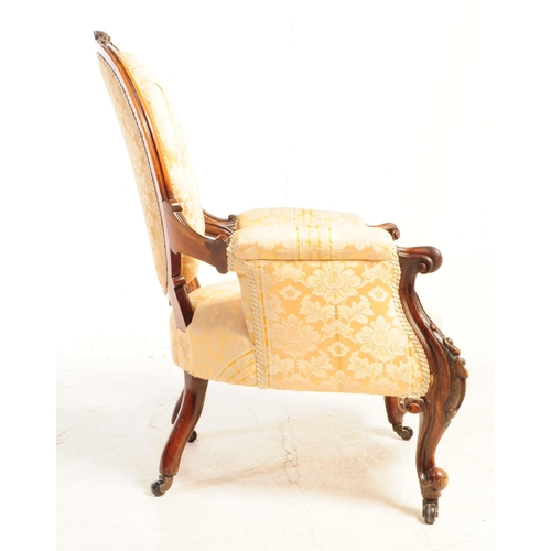 804 - A 19th century Victorian carved walnut Gentlemen's spoon back armchair. With button cushioned back d... 