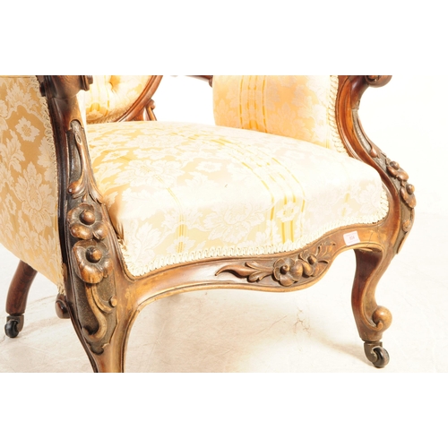 804 - A 19th century Victorian carved walnut Gentlemen's spoon back armchair. With button cushioned back d... 