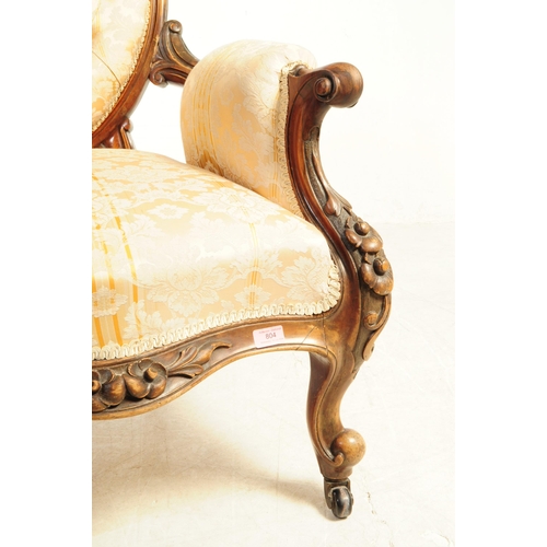 804 - A 19th century Victorian carved walnut Gentlemen's spoon back armchair. With button cushioned back d... 