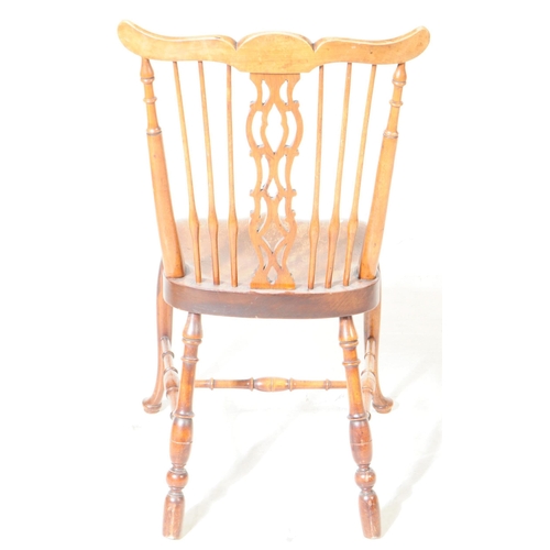 807 - A 19th century ash and elm Windsor chair. With top rail moustache style top into pierced splat spind... 