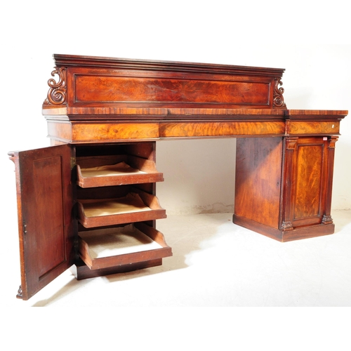 810 - A early 19th century solid flame mahogany inverted breakfront twin pedestal sideboard. With large ga... 