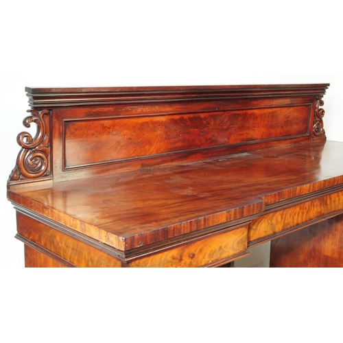 810 - A early 19th century solid flame mahogany inverted breakfront twin pedestal sideboard. With large ga... 