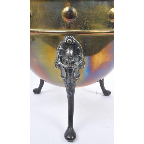 1003 - A 19th century Victorian brass and iron cauldron / pot. With ring carry handles, embossed circular d... 