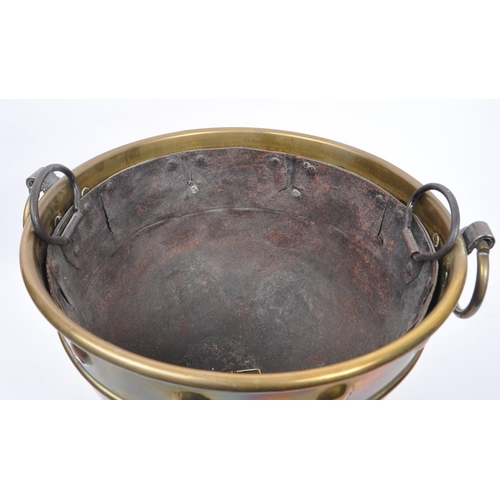 1003 - A 19th century Victorian brass and iron cauldron / pot. With ring carry handles, embossed circular d... 